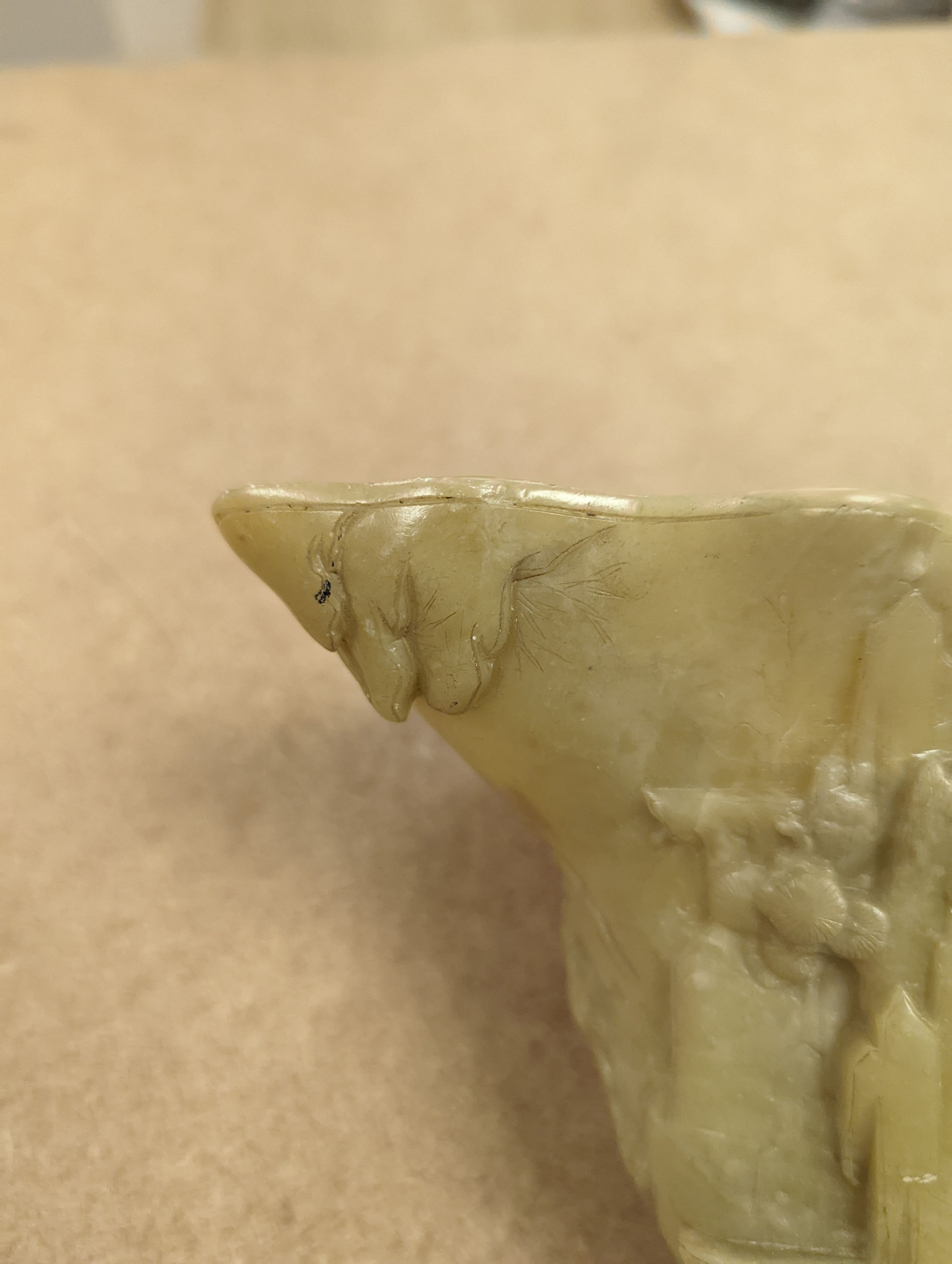 A Chinese carved soapstone libation cup, 19cm